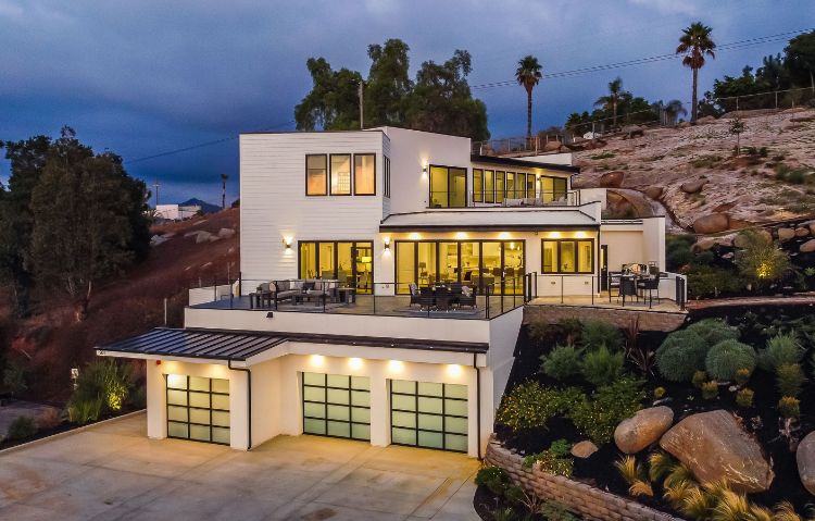 a house with a large patio and a driveway
